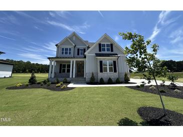 Beautiful two-story home with a manicured lawn, covered porch, and classic curb appeal at 190 Broadleaf Ln, Youngsville, NC 27596