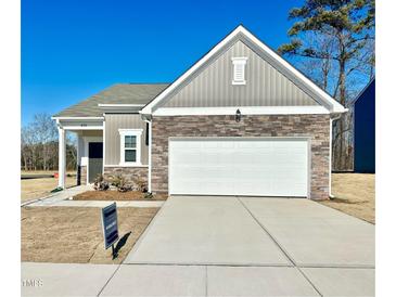 Newly constructed craftsman style home with stone and board and batten accents at 456 Glover Park Memorial Drive, Nashville, NC 27856
