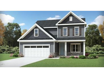 Two-story Craftsman style home with gray siding, white trim, and stone accents at 912 Thimbleweed Way, Wake Forest, NC 27587