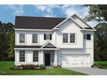Two-story white house with a two car garage and landscaped front yard at 1908 Old Bramble Ln # 8, Fuquay Varina, NC 27526