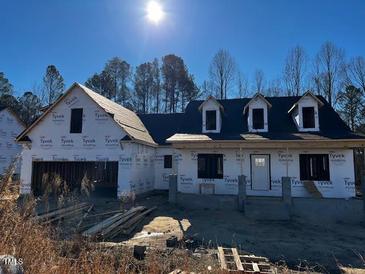 New construction home exterior; showcasing a spacious design at 30 Seahawk Way, Zebulon, NC 27597