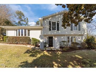 Two-story house with gray siding, landscaping, and a black front door at 317 Compton Rd, Raleigh, NC 27609