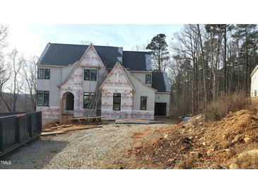 Two-story house under construction, featuring a charming architectural design and large windows at 286 W Beech Slope Ct, Chapel Hill, NC 27517