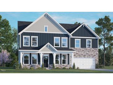 Two-story home with gray and blue siding, stone accents, and a 2-car garage at 313 Umstead St, Sanford, NC 27330