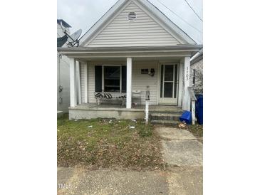 Simple one-story house with front porch and small yard at 1103 E Lane St, Raleigh, NC 27601