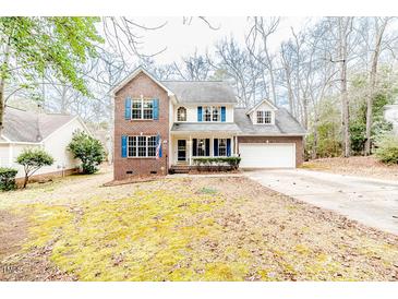 Brick two-story house with attached garage and landscaped lawn at 516 Argyll Dr, Sanford, NC 27332