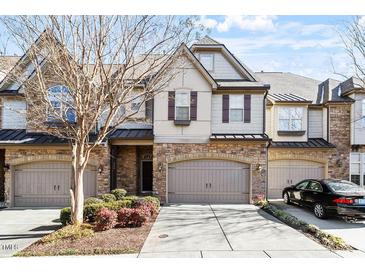 Beautiful 2-story townhome with stone accents and 2-car garage at 324 Sunstone Dr, Cary, NC 27519