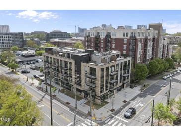 Modern condominium building showcasing a mix of brick and contemporary design in an urban setting at 615 W Peace St # 307, Raleigh, NC 27605