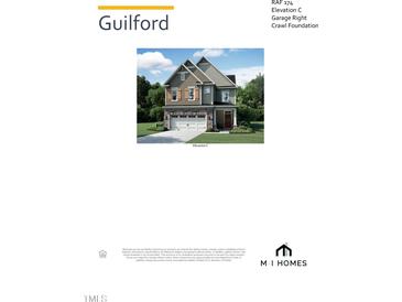 Two-story home with grey siding, white trim, and a black roof at 2488 Field Poppy Drive Dr # 174, Apex, NC 27502