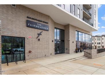 Apartment building entrance featuring modern architectural details and clear signage at 523 S West # 305, Raleigh, NC 27601