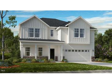 Two-story farmhouse-style home with white siding, stone accents, and a two-car garage at 2012 Clydner Dr, Apex, NC 27523
