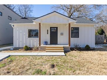 Charming white farmhouse-style home with a covered porch at 2207 Edwin Ave, Durham, NC 27705