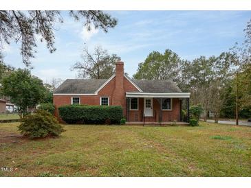 Brick house with a porch and well-manicured lawn at 601 Rose St, Rocky Mount, NC 27801