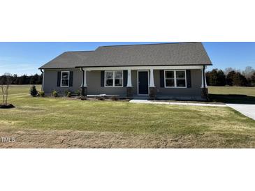 Newly constructed craftsman style home with a covered porch at 39 Harvest Hills Ln, Dunn, NC 28334