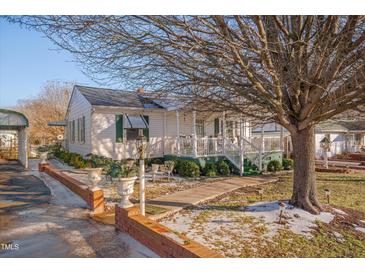 Charming single story home with front porch and mature trees at 505 Forrest St, Hillsborough, NC 27278