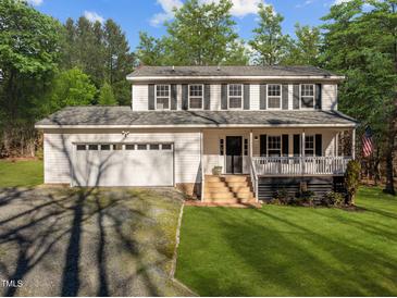 Two-story white house with attached garage and porch at 341 Harts Creek Dr Dr, Pittsboro, NC 27312