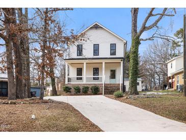 Two-story craftsman home with white siding, black windows, and a front porch at 649 Mcadams Rd, Hillsborough, NC 27278