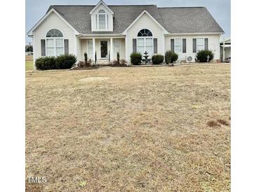 One-story house with a large front yard and attached garage at 59 Mar-Joy Dr, Dunn, NC 28334