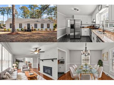 White ranch home with black windows, steps, and landscaping at 1117 Beechwood Dr, Rocky Mount, NC 27803