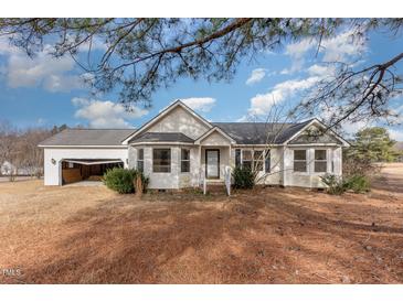 Ranch-style home with attached garage and spacious yard at 210 Alfalfa Ct, Smithfield, NC 27577
