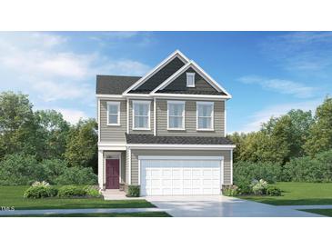 Two-story house with gray siding, white garage door, and maroon front door at 1185 Atterlee Ln, Graham, NC 27253