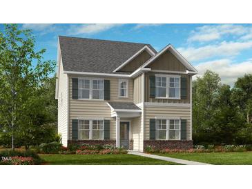 Two-story house with beige siding, gray shutters, and brick accents at 1252 Hardin Hill Ln, Knightdale, NC 27545