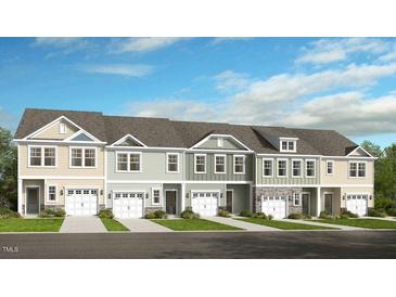Brand new townhouses with 2-car garages and attractive landscaping at 22 Shay St, Angier, NC 27501