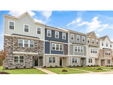 New townhome community with 3-story homes and attractive exterior finishes at 701 Lucky Clover Way, Fuquay Varina, NC 27526