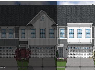 Two-story townhome with gray siding, white accents, and a two-car garage at 174 Nimble Way # 222, Clayton, NC 27520