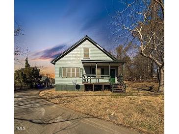 Ranch style home with front porch and driveway at 530 W King St, Hillsborough, NC 27278
