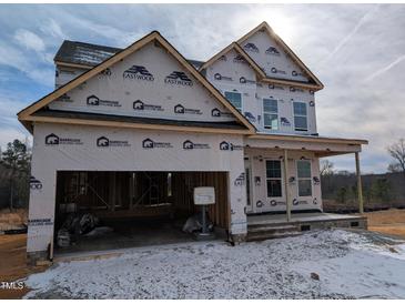 Two-story house under construction with a large garage at 19 Grassland Dr, Garner, NC 27529