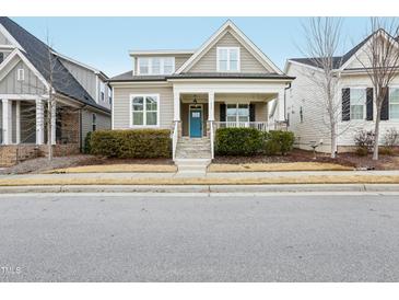 Two-story Craftsman home with a charming front porch and landscaping at 213 Quarter Gate Trace, Chapel Hill, NC 27516