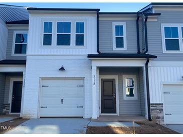New construction townhome with gray siding and white trim at 5002 Cambrey Dr # 2, Durham, NC 27703