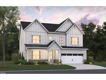 Two-story home with white siding, gray roof, and a two-car garage at 1113 Opal Ln # 72, Durham, NC 27705