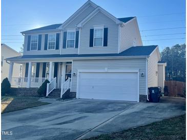 Two-story house with attached garage and front porch at 121 Gratiot Dr, Morrisville, NC 27560