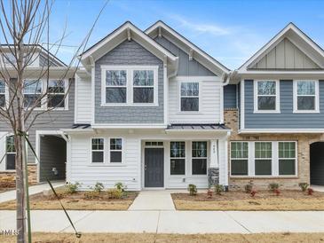 Two-story townhome with gray and white siding, and a gray front door at 310 Church St # 35, Wendell, NC 27591