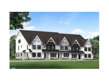 Three-unit townhome building with modern farmhouse style and a landscaped lawn at 917 Myers Point Dr # 21, Morrisville, NC 27560