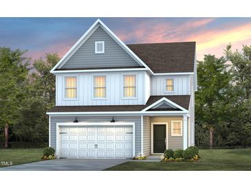 Two-story home with gray siding, neutral accents, and a two-car garage at 1015 Freestone Rd, Durham, NC 27703