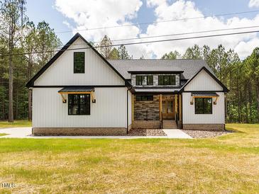 Charming new construction home with modern farmhouse design and beautiful curb appeal at 1040 Southern High School Rd, Burlington, NC 27215
