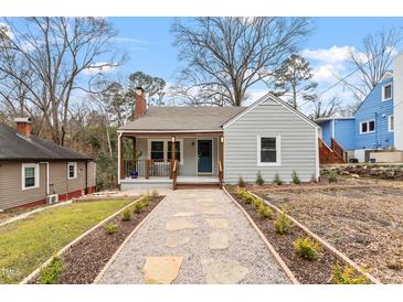 Charming single-story home with gray siding, inviting front porch, and landscaped front yard at 1606 James St, Durham, NC 27707