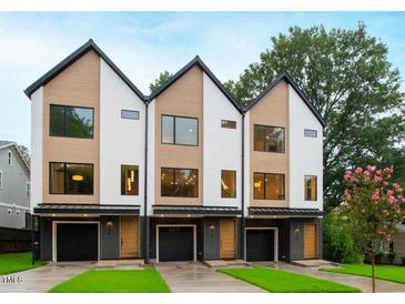 Three modern townhouses with attached garages and manicured lawns at 2119 Brewer St, Raleigh, NC 27608