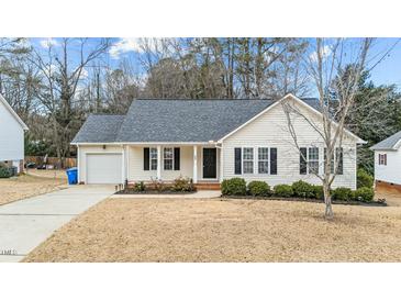 Charming one-story house with a gray roof and attached garage at 608 Senter View Dr, Fuquay Varina, NC 27526