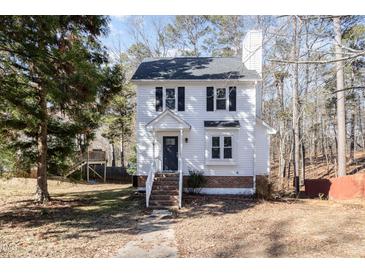 Two story house with white siding and a dark door at 117 London Plain Ct, Cary, NC 27513