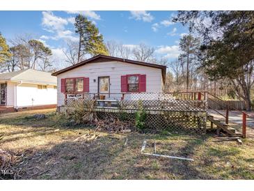 Ranch home with red shutters, deck, and large yard at 602 E Club Blvd, Durham, NC 27704