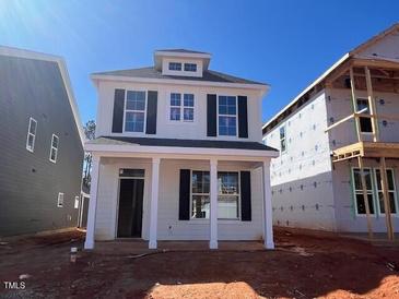New construction home featuring a classic design with large windows and inviting front porch at 731 Georgia'S Landing Pkwy # 111, Raleigh, NC 27603