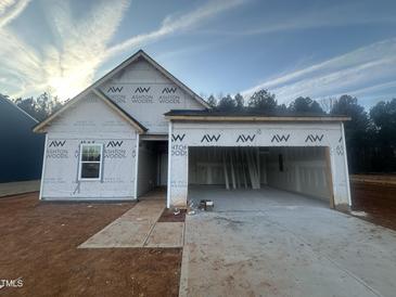 New construction home with a two-car garage and front yard at 11186 Salers Loop, Middlesex, NC 27557