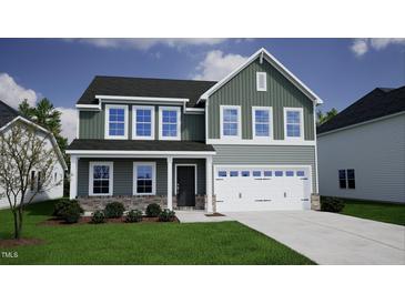 Two-story home with gray siding, stone accents, and a two-car garage at 25 Calabria Ct, Franklinton, NC 27525