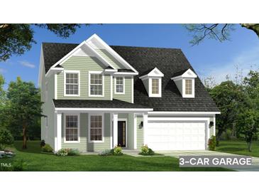 Two-story house with a three-car garage and a light green exterior at 92 Frost Meadow Way # 105, Lillington, NC 27546