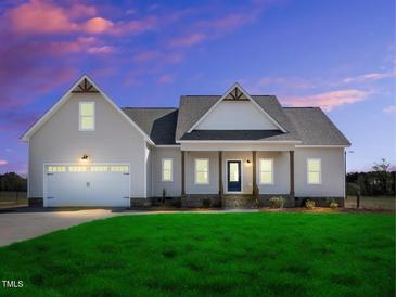 Charming single Gathering home with attached garage and well-manicured lawn in a quiet neighborhood at 1178 Sheriff Johnson Rd, Lillington, NC 27546