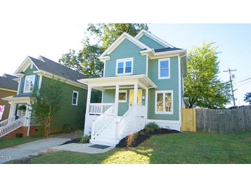 Charming two-story craftsman home with a white porch at 300 Worth St, Raleigh, NC 27601